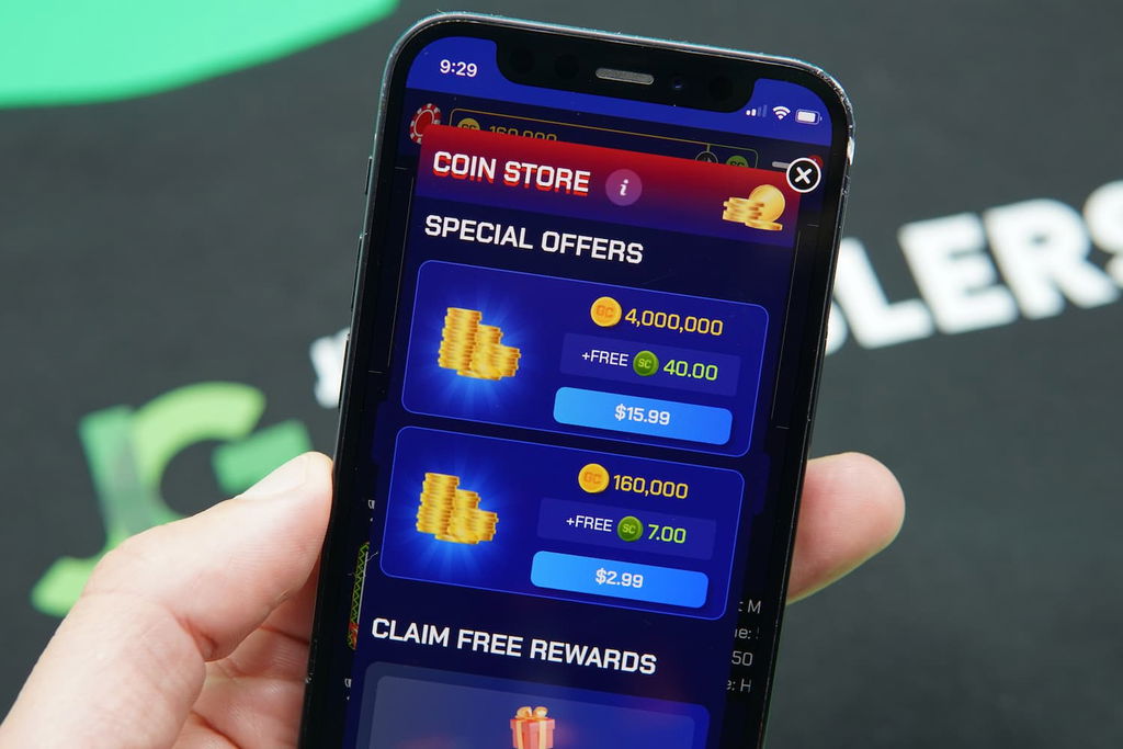 Patrik Lidin holding an iPhone with the Sportzino casino purchases page loaded on the webpage.