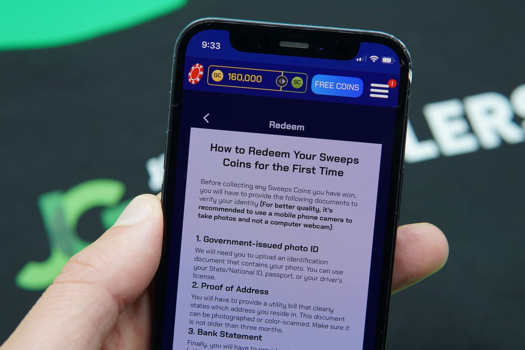 Patrik Lidin holding an iPhone with the Sportzino casino redemptions page loaded on the webpage.