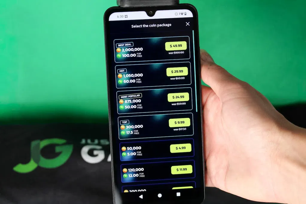 Angela Zillich holding an iPhone with the SweepShark casino coin store page loaded on the webpage.