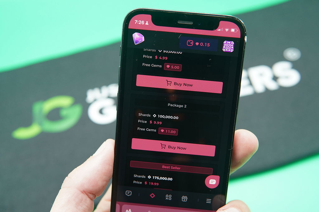 Patrik Lidin holding an iPhone when purchasing coins on Vegas Gems casino.