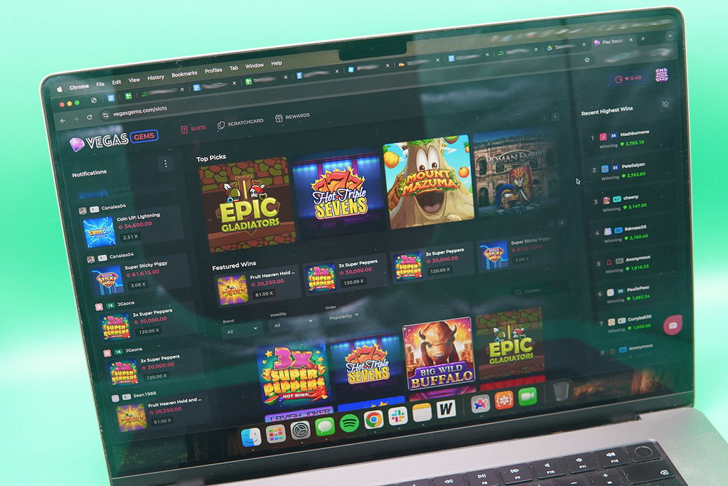 MacBook with the Vegas Gems starting page loaded in Chrome browser.