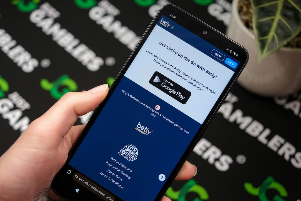 Photo of Betly WV online casino on an iPhone.