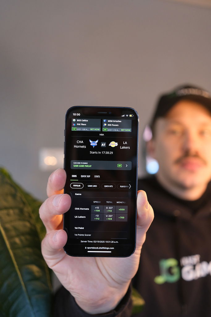Photo of Patrik Lidin holding up a WV online gambling site.