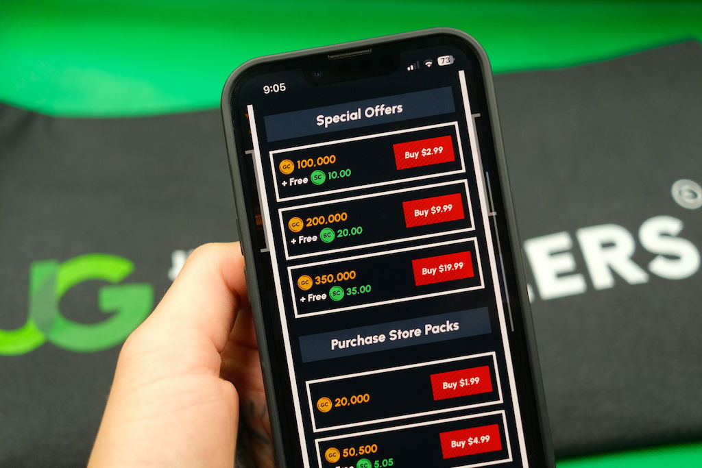 Patrik Lidin holding an iPhone with the Yay casino coin store page loaded on the webpage.