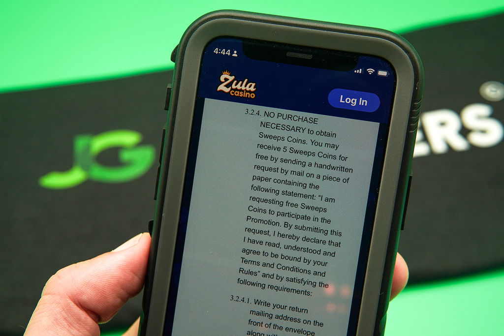 Photo of the Zula Casino AMOE instructions displayed on an iPhone.